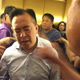 Shan Jiuliang surrounded by Fanya investors.